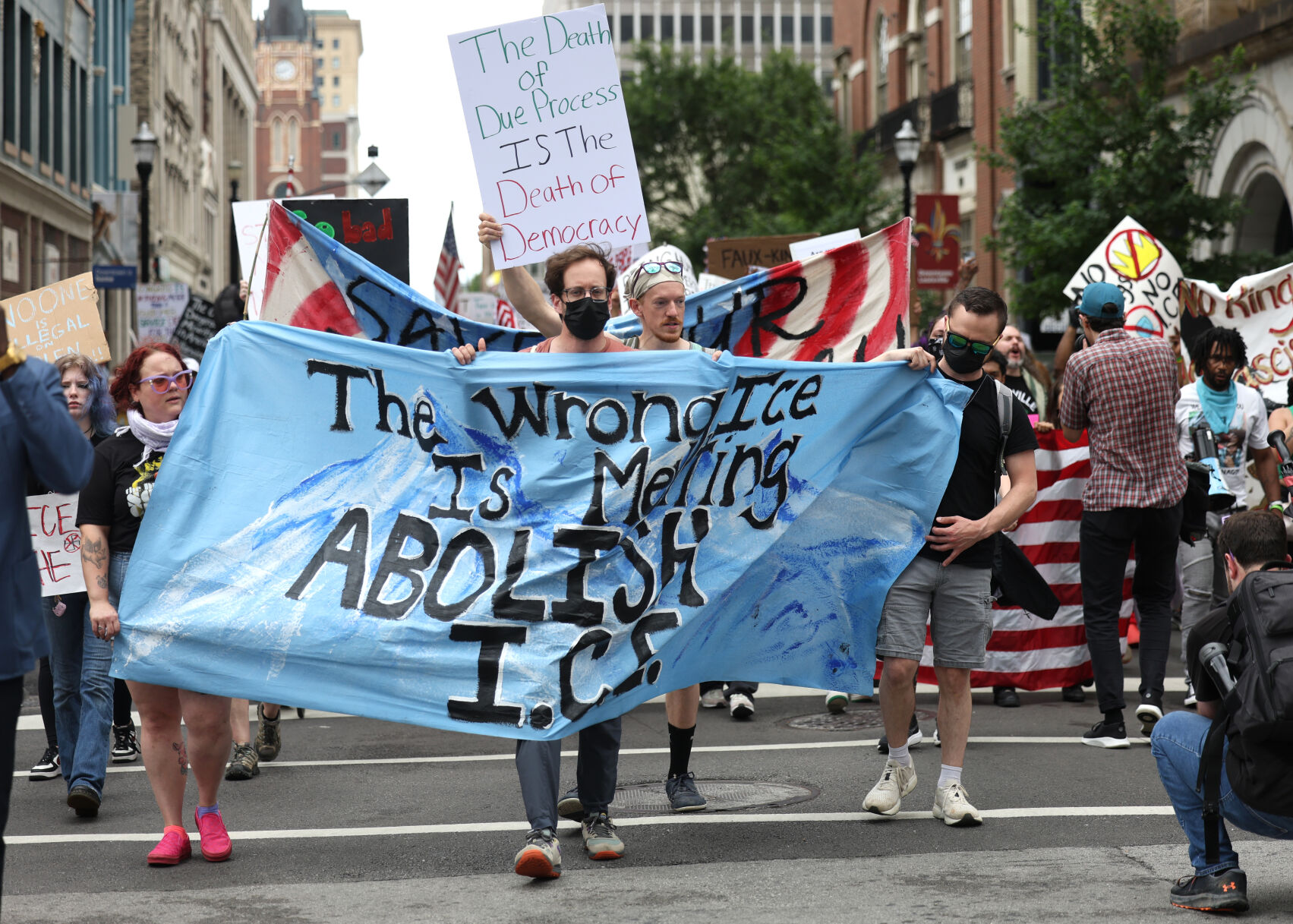 Marcher holds up sign.JPG